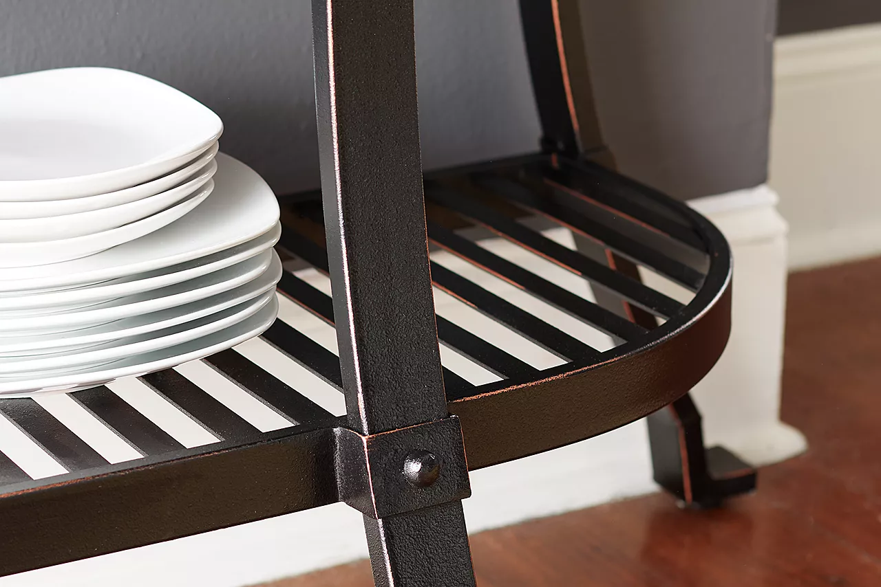Closeup of the bottom shelf of the Copper Canyon Buffet in Copper in a room scene.
